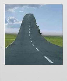 Polaroid photo of a surrealist landscape of a highway going into the sky